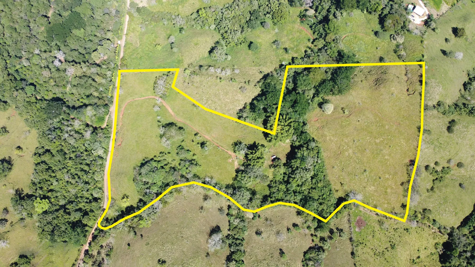 Drone view showing the outlined Finca Monte Romo parcel